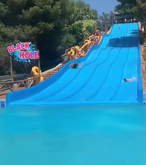 The teen ended up on his side halfway down the slide