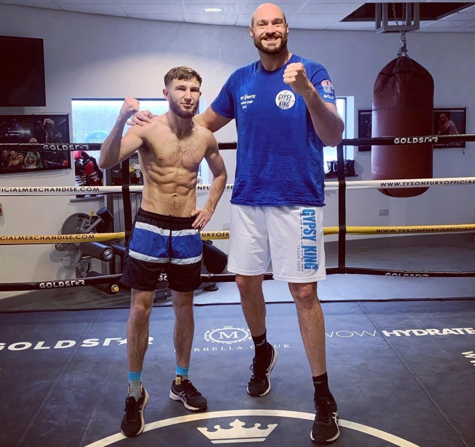 Isaac Lowe pictured with Tyson Fury