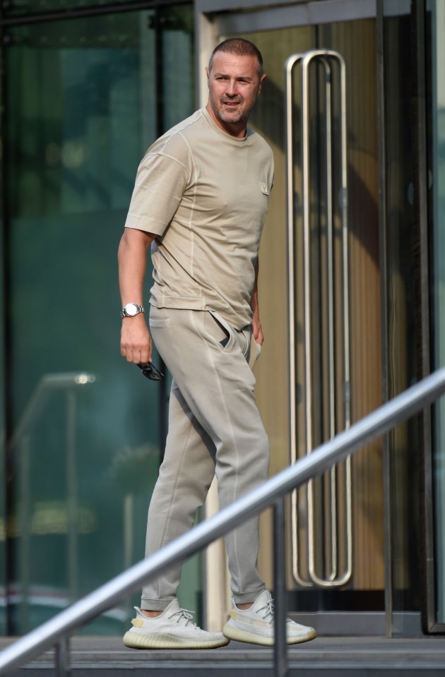 Chirstine’s sunny grin contrasted with 49-year-old Paddy’s sombre demeanor outside Manchester’s Lowry Hotel