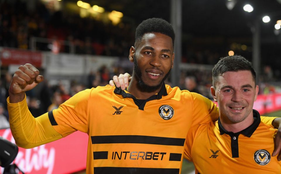 Goalscorers Jamille Matt and Padraig Amond celebrate Newport's win over Leicester in 2019.