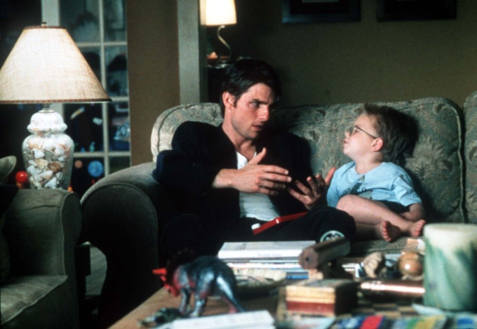 The child star is seen with Tom Cruise in Jerry Maguire