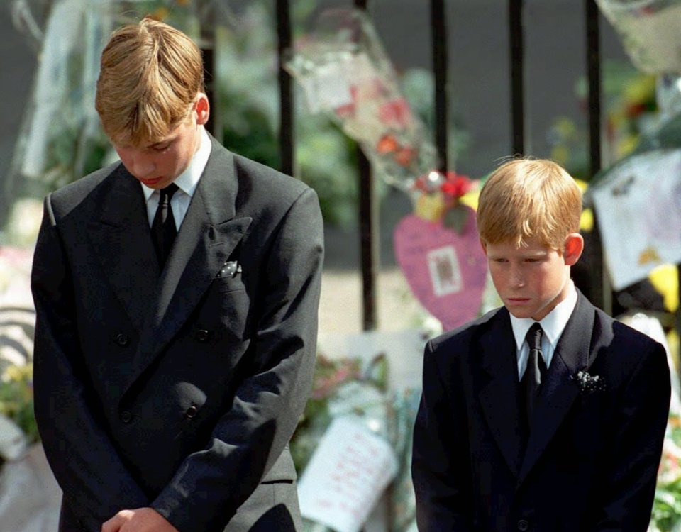 Prince William and Prince Harry bow their heads as their mother’s coffin is taken out of Westminster Abbey