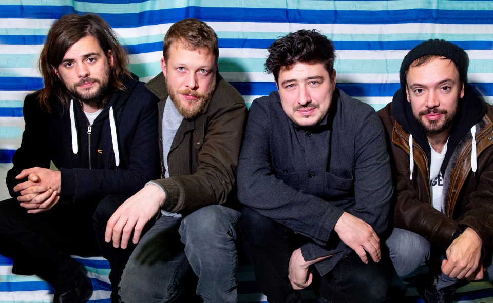 Marcus with his band mates (L-R) Winston Marshall, Ted Dwane and Ben Lovett