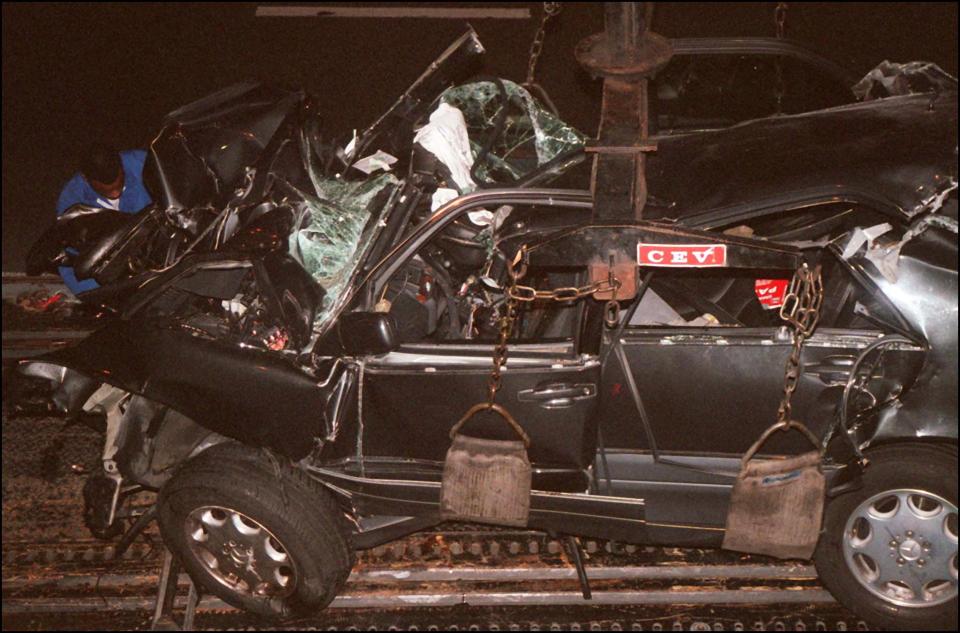 A French policeman attends the wreckage of Princess Diana’s car in the Alma tunnel of Paris