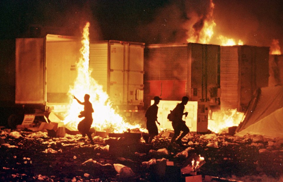 Fires burn through trailers and debris at Woodstock ’99