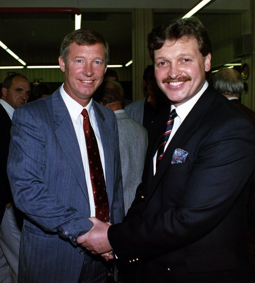 Alex Ferguson shaking hands with former board member Michael Knighton