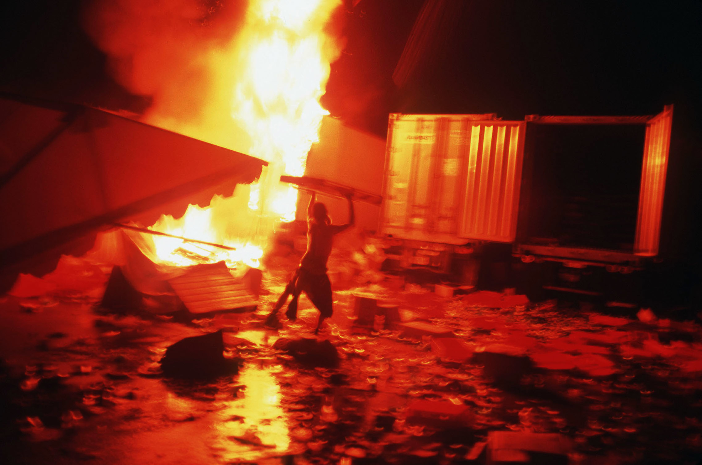 Fires burn through trailers and debris