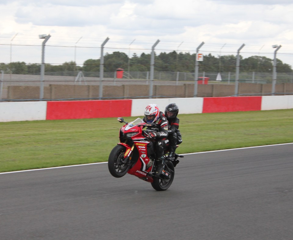 She rode with motorbike rider Ron Haslam at Donnington