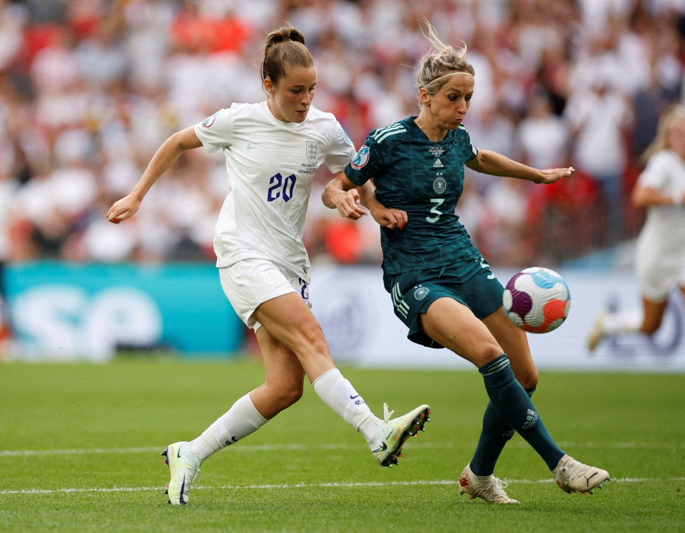 Toone dinks the ball over the Germany keeper for England's opener at Wembley