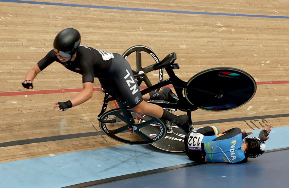 Bryony Botha of New Zealand tumbled over Meenakshi as she slid down the bank