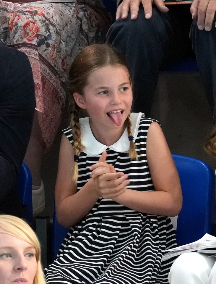 The young royal was all smiles as she sat with her parents