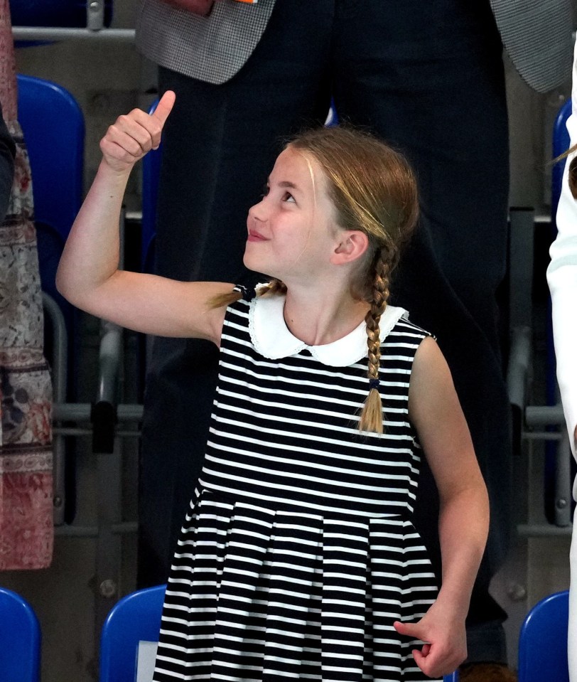 Princess Charlotte gives the thumbs up