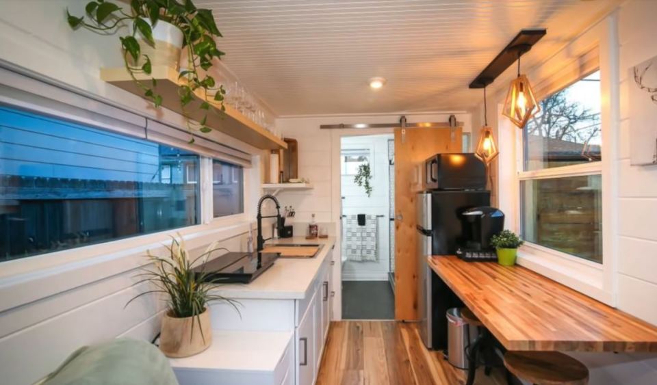 The kitchen has loads of counter space and a large fridge