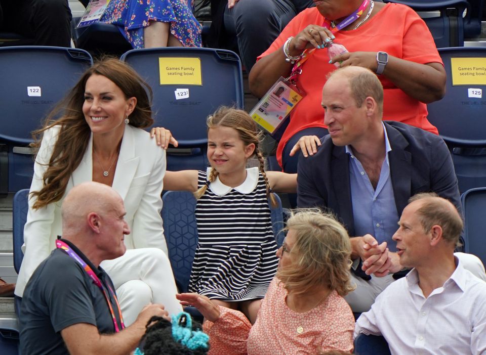 The Duke and Duchess of Cambridge with Princess Charlotte seated behind The Earl and Countess of Wessex