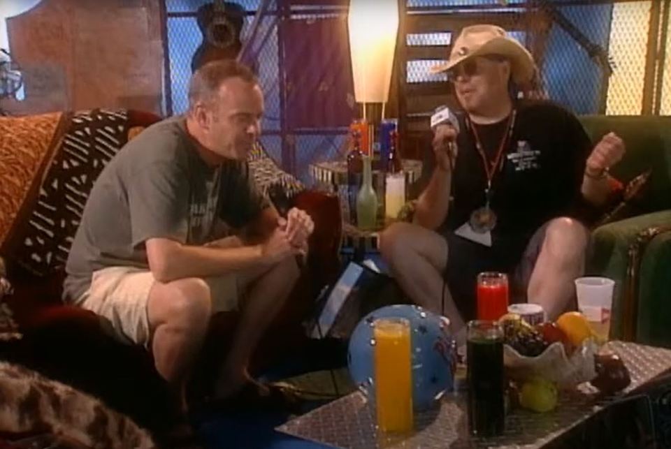 Fatboy Slim talks to an MTV reporter backstage