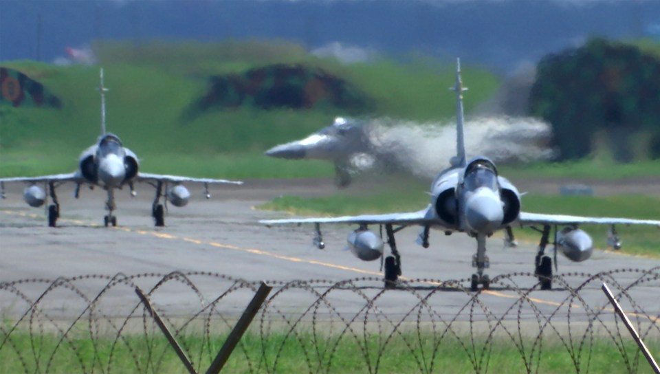 Taiwan Air Force Mirage fighter jets taxi on a runway at an airbase in Hsinchu