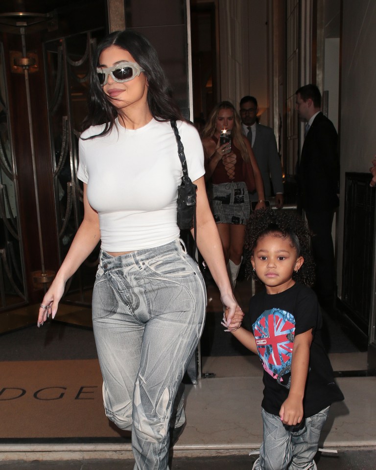 Kylie Jenner wore this tight white top and grey stonewashed jeans as she and her daughter Stormi headed to the O2 Arena