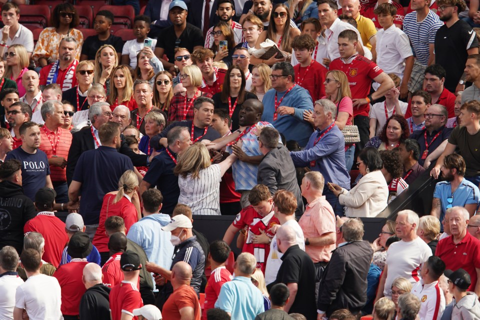 Fans had to be pulled apart in tense scenes at Old Trafford