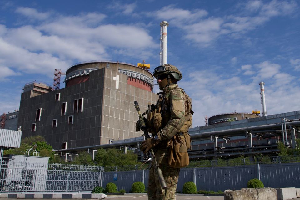 A Russian serviceman patrols the territory of the Zaporizhzhia Nuclear Plant