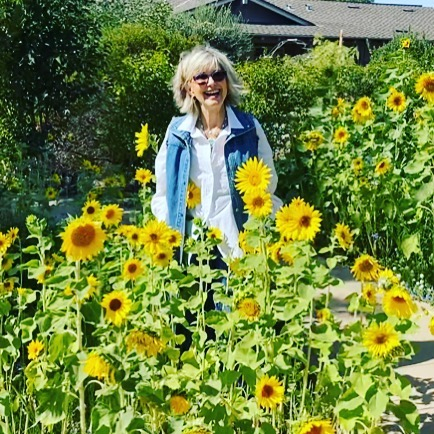 The last picture taken of Olivia - smiling with sunflowers, in April