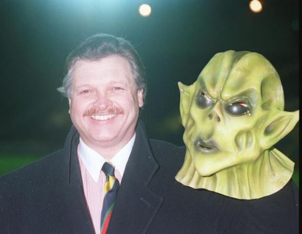 Michael Knighton poses with an alien mask