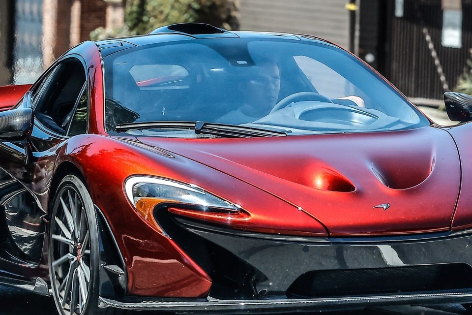 Brooklyn appeared relaxed behind the wheel of the luxurious red vehicle