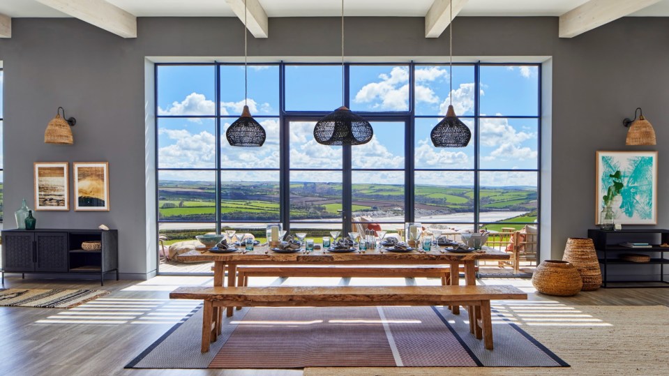 Massive windows allow light to flood into the property