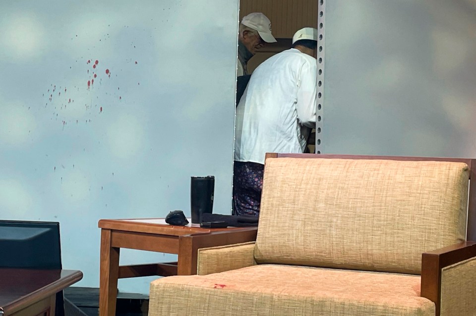 Blood on a screen in the lecture hall following the shocking attack