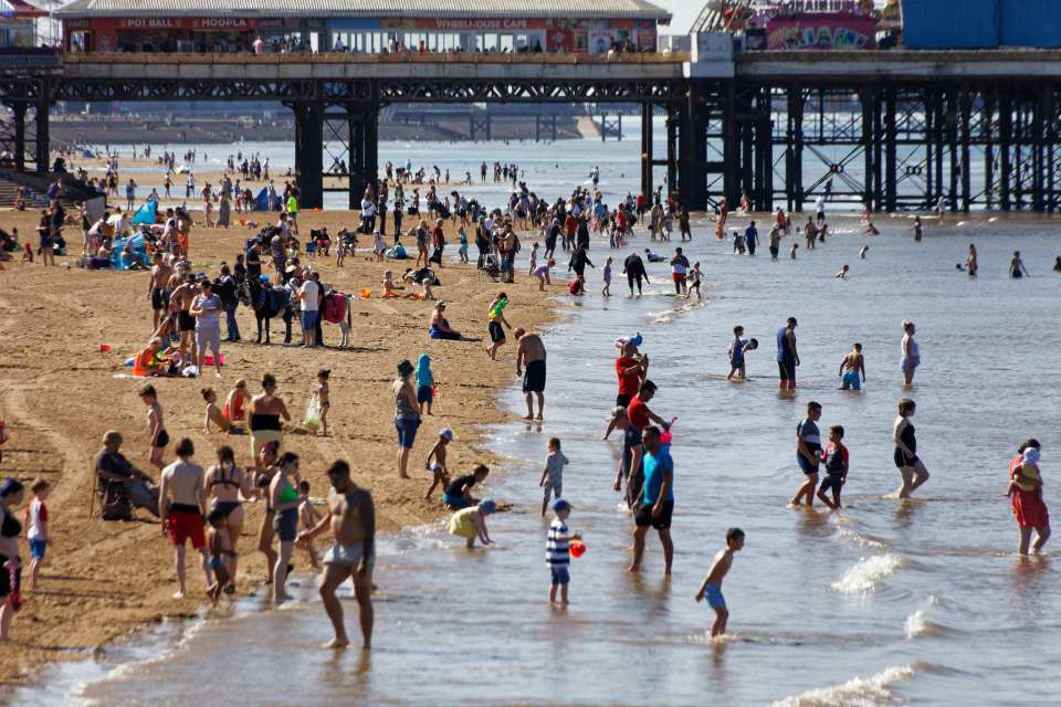 Families make the most of the sunshine on the beach in Blackpool