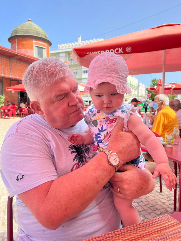 Daisy's dad James, who was recovering from surgery and in a wheelchair, with his granddaughter