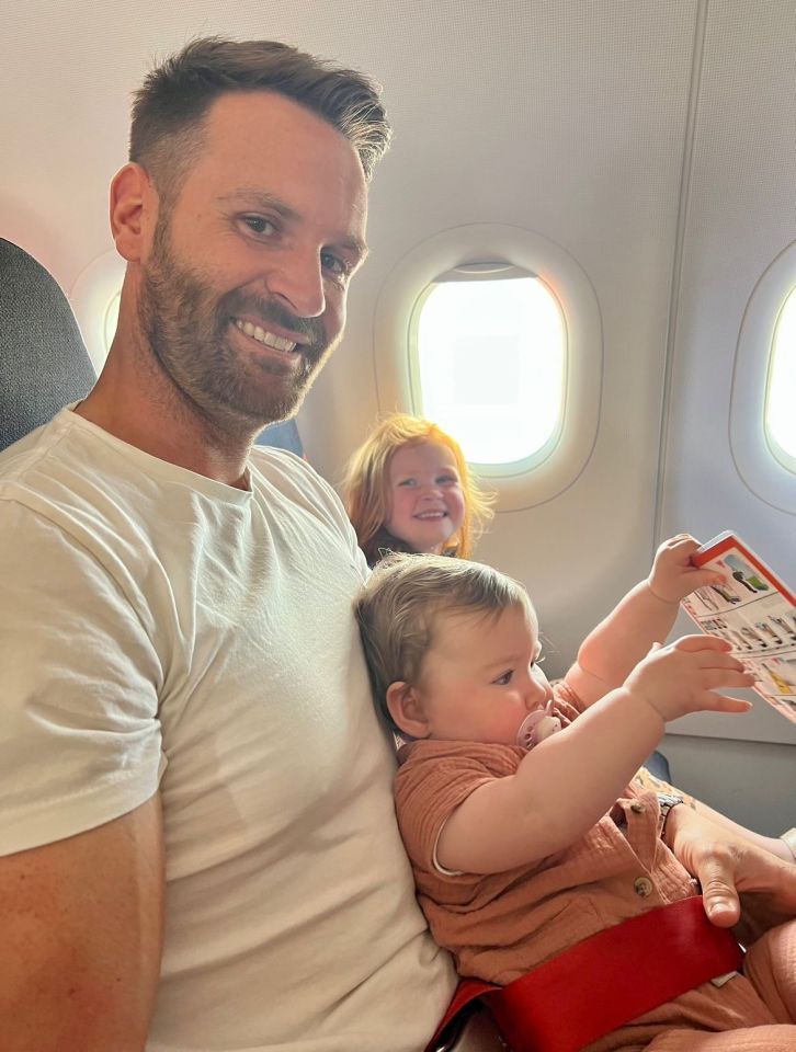 Daisy's husband Dave with their two children on the flight to Faro, Portugal