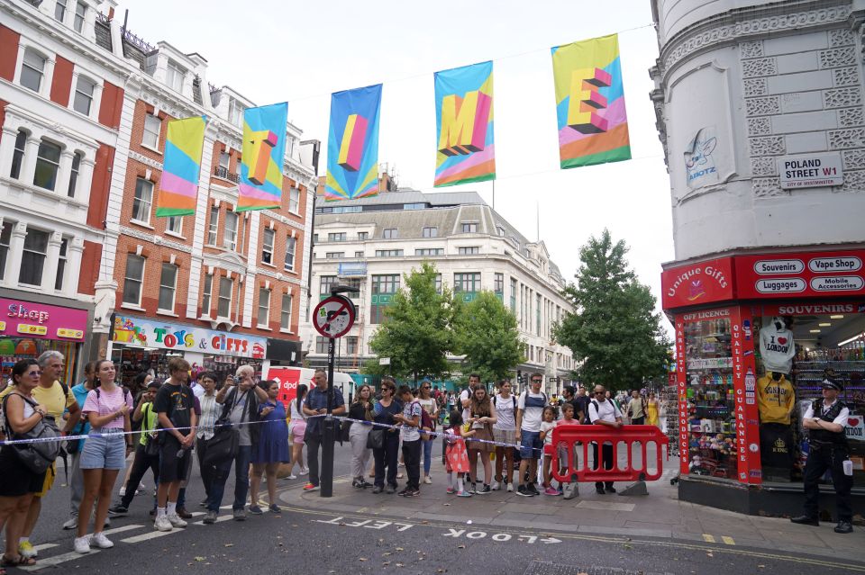 Shoppers from the iconic road crowd at the scene of the crime