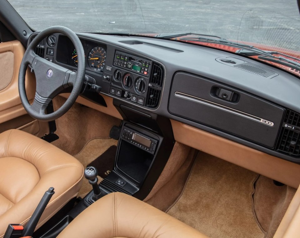 The interior looks superb in tan leather and is perfectly-preserved