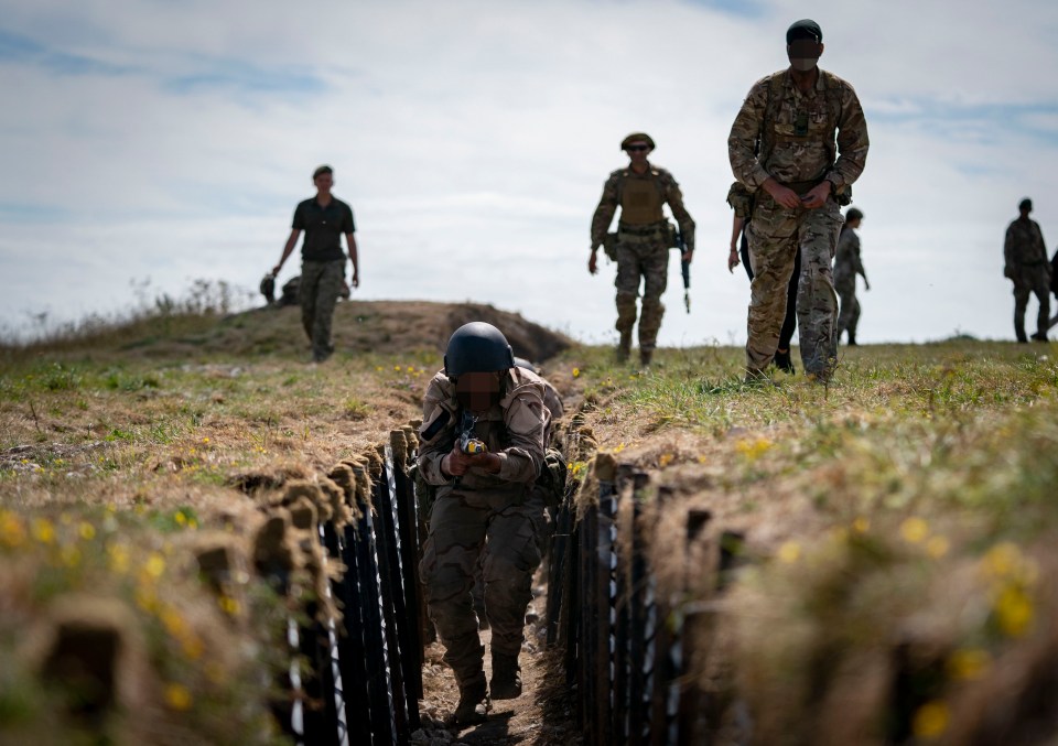 A dozen Ukrainian soldiers charge into a 200-yard-long Cold War-style trench, stepping over casualties to kill the enemy