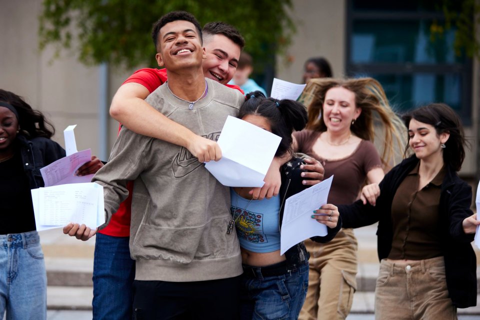 Nicholas Youmbi-Youdom and Afia Minhas celebrating their results success at Barlow RC High School in Didsbury