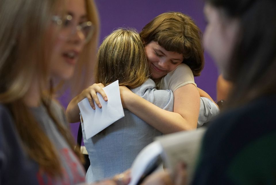 Students congratulate each other receiving their GCSE results at Roedean School, Roedean Way, Brighton in Brighton, Sussex