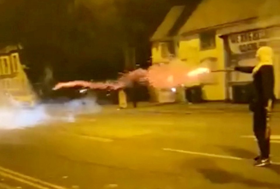 A mindless yob shot at police with fireworks