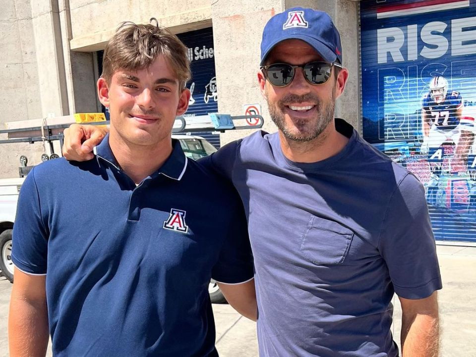 The proud dad posed for a snap with Charley as they arrived at the University