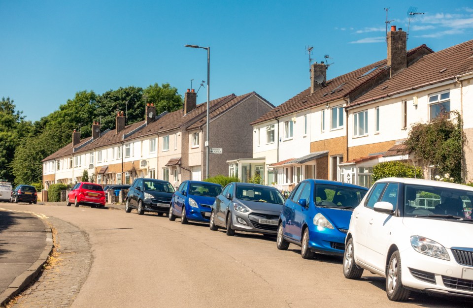 A woman has told how her neighbour has four cars - but refuses to park them on his driveway or in his garage. Pictured, stock image