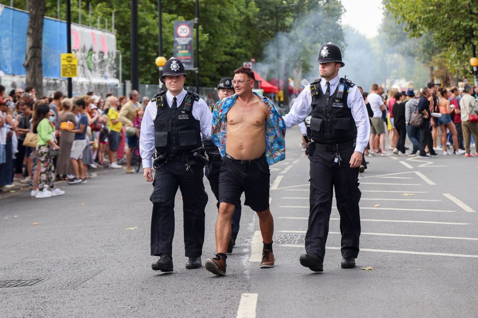 Police detain a man in handcuffs