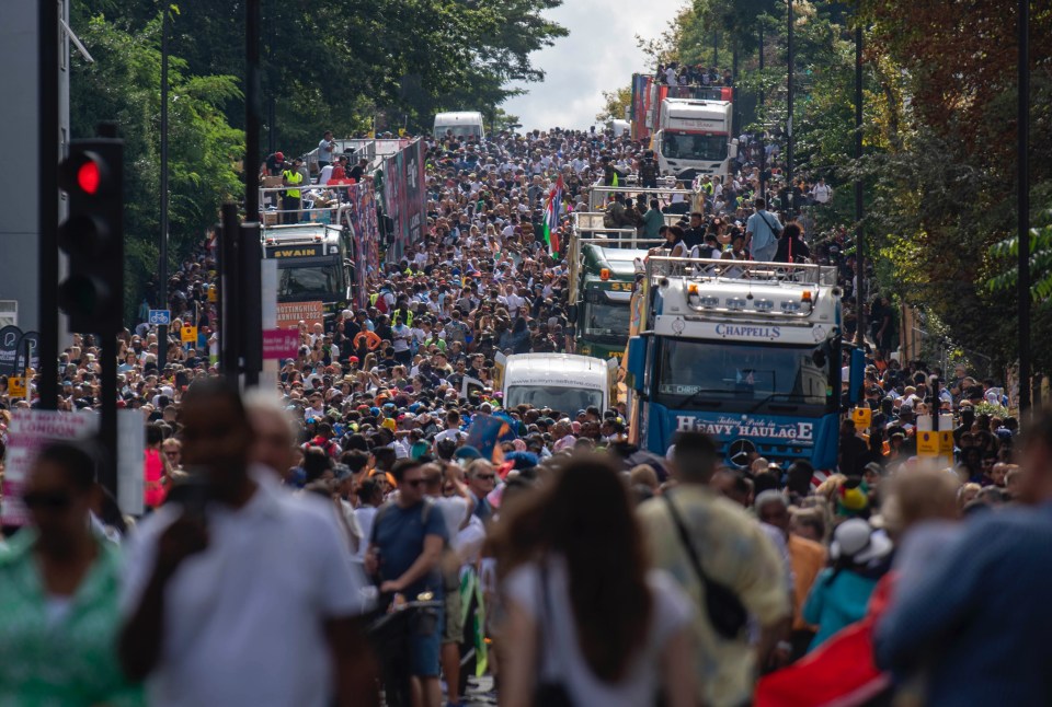 Revellers enjoy the Notting Hill Carnival for the first time in three years