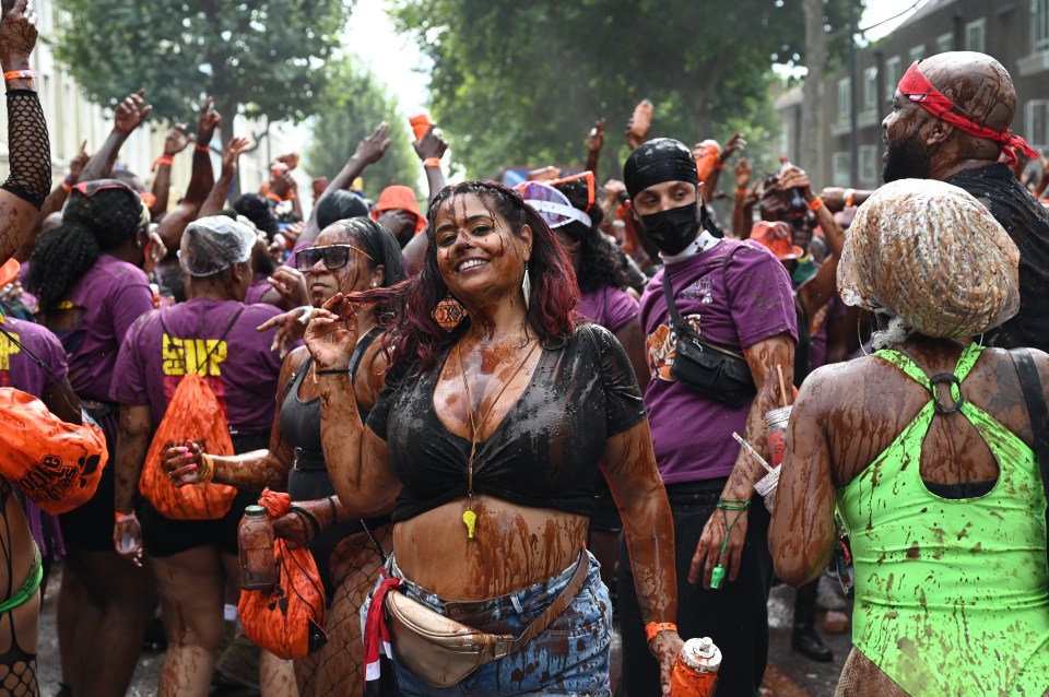 Revellers enjoy the Notting Hill Carnival for the first time in three years