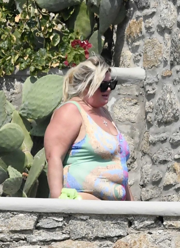 Gemma showed off her figure in the colourful swimsuit