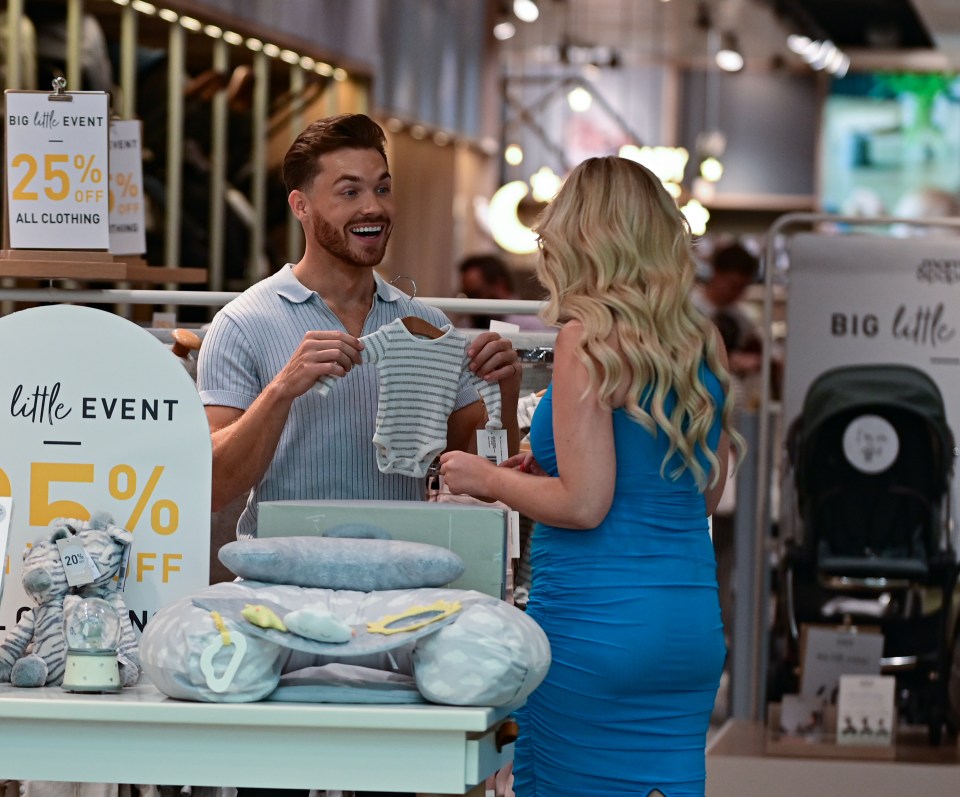 The couple headed out to buy clothes for their little one