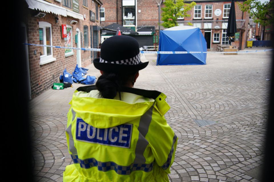 Police on the scene in Altrincham, Greater Manchester, following the attack