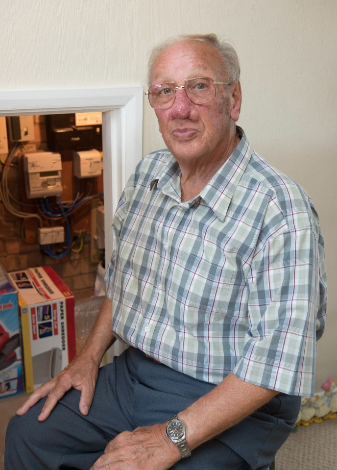 Allen Frusher from Wisbech by his electric meter cupboard after receiving bills to a total of £3500