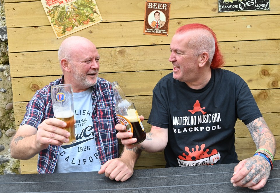 John Ferns and Graham Goodwin enjoy their drinks outside