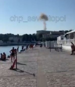 Black smoke appears to rise from the Black Sea Fleet base after a reported strike