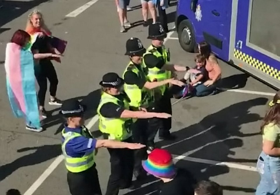 Police officers pictured dancing the Macarena at the Lincoln Pride Festival last week