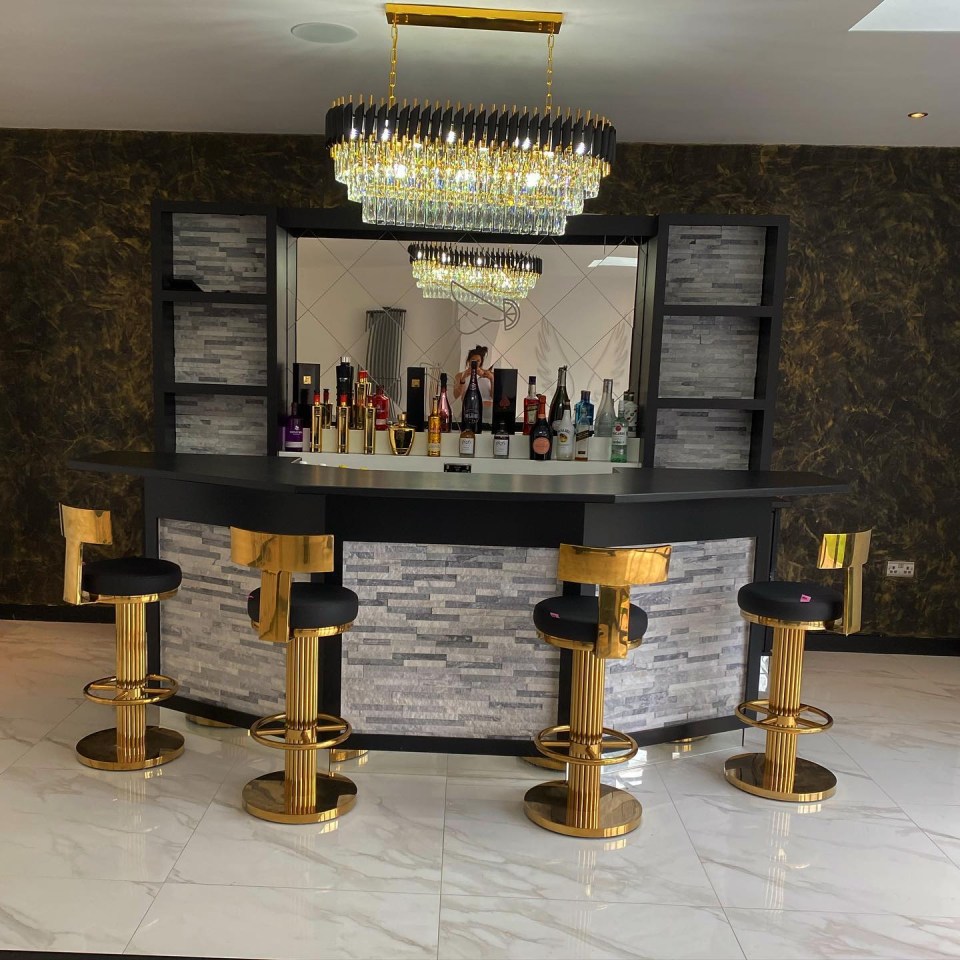 The home has a chic bar area